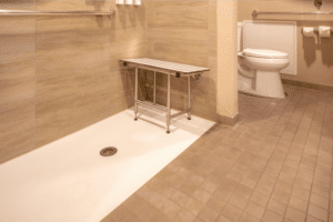 Barrier-free ADA accessible shower with a built-in bench and grab bars