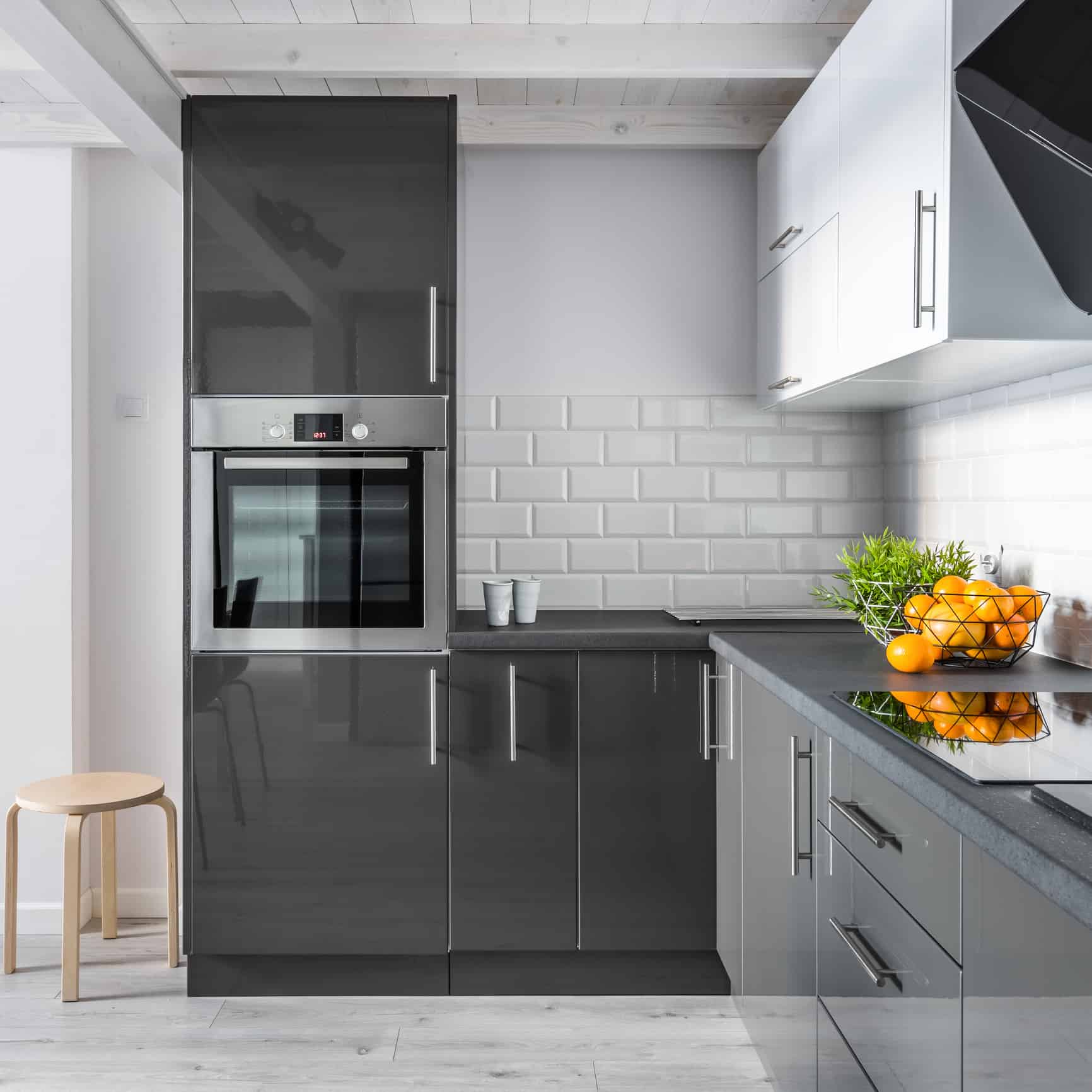 Elegant kitchen interior with brick tiles and modern cupboards
