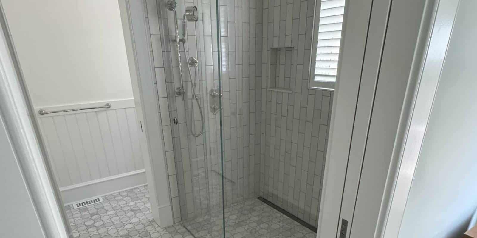 waterproof membrane layers behind tile shower installation