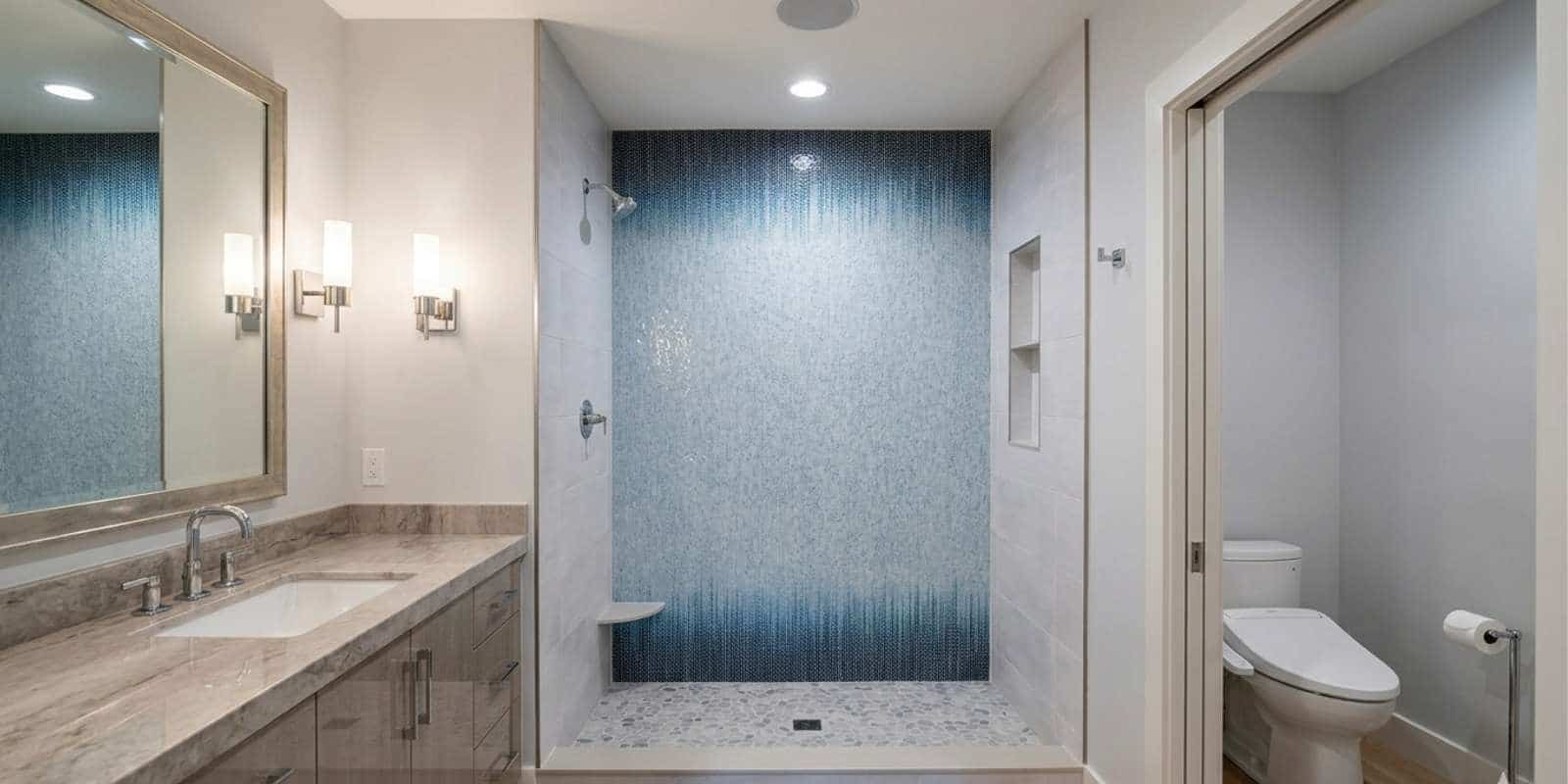 modern walk-in shower design with frameless glass and clean tile layout