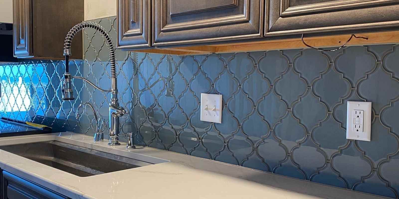 textured tile backsplash adds depth and style