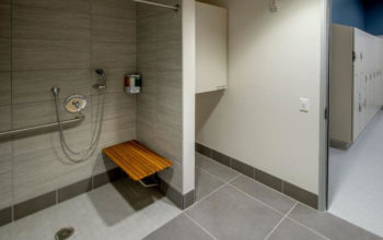 ADA accessible shower with barrier-free entry and built-in bench